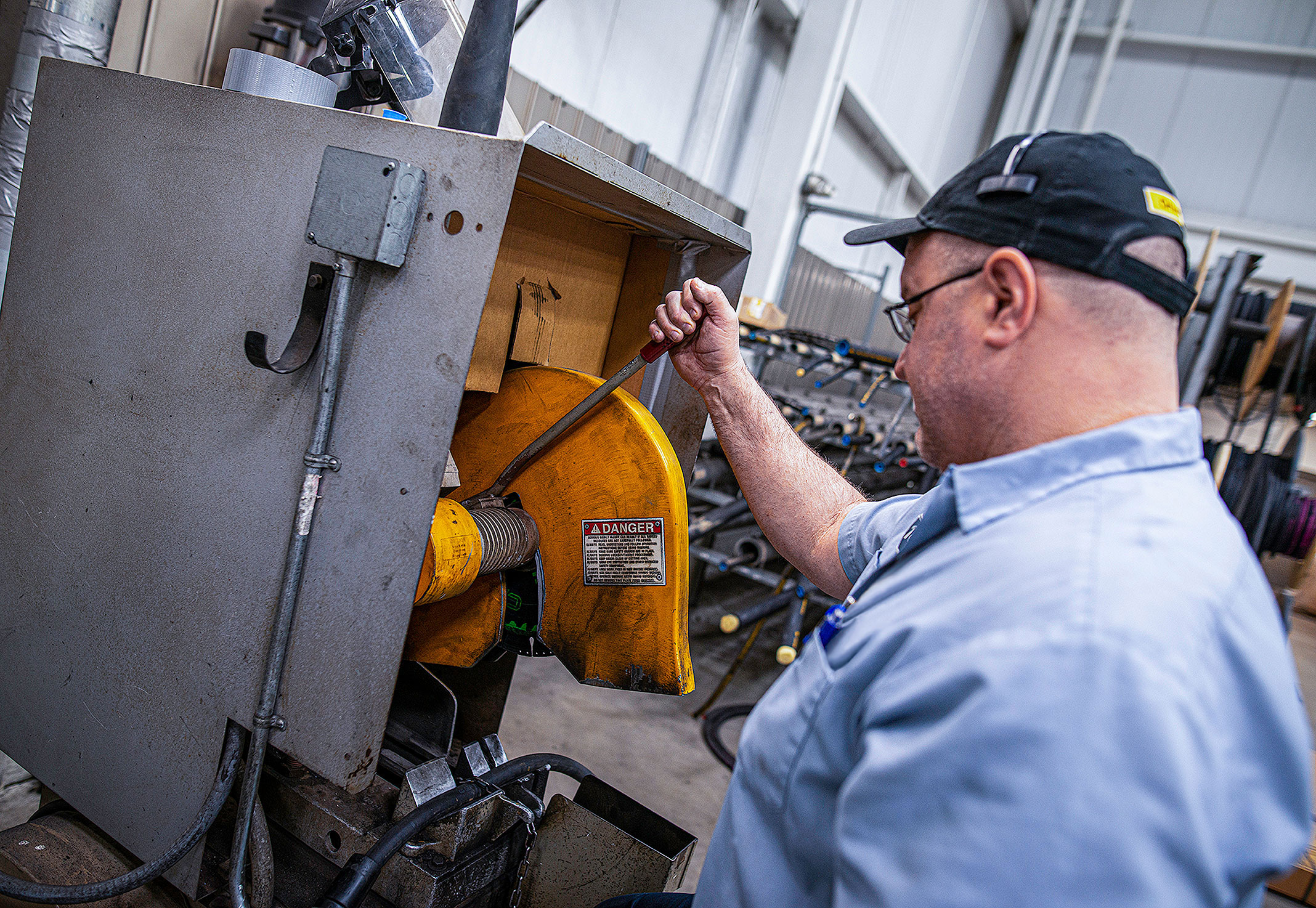 a complete employee working on a hose