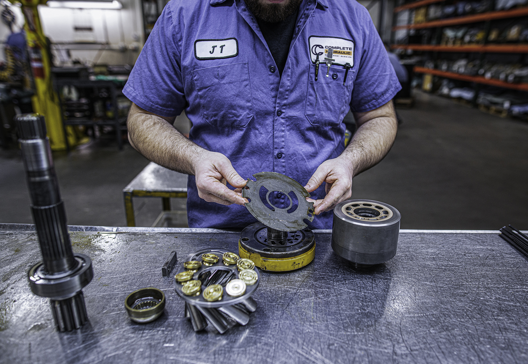 Employee putting together a pump in the pump shop