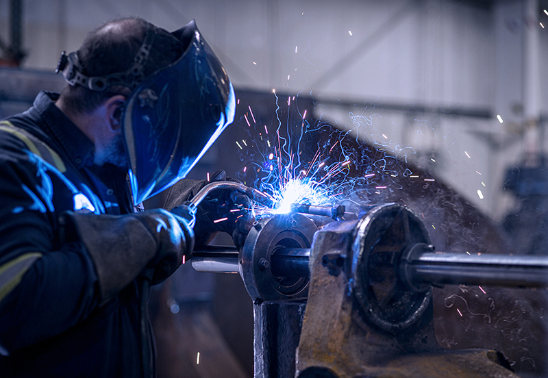 Welder with welding mask on